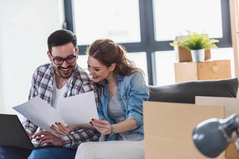 happy couple preparing for moving house