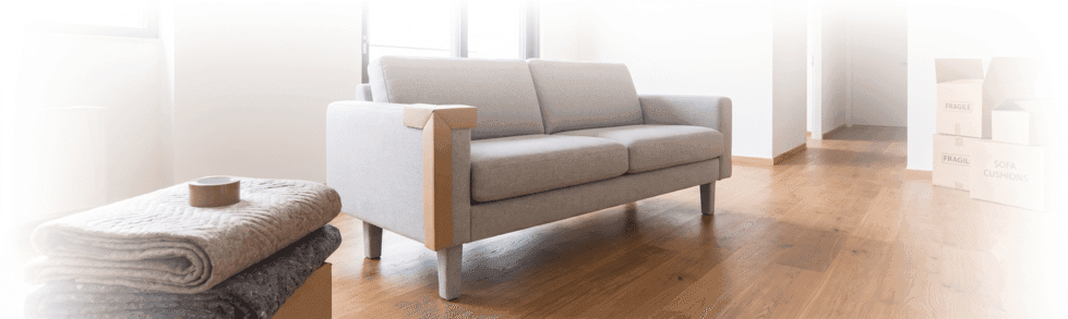 grey couch ready for removal